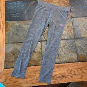 Gray Puma leggings with pink Puma logo at left hip